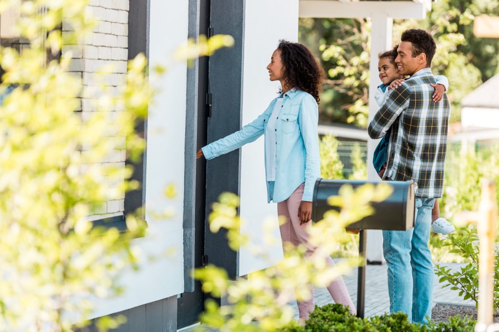a young family visiting a home in a build-to-rent community