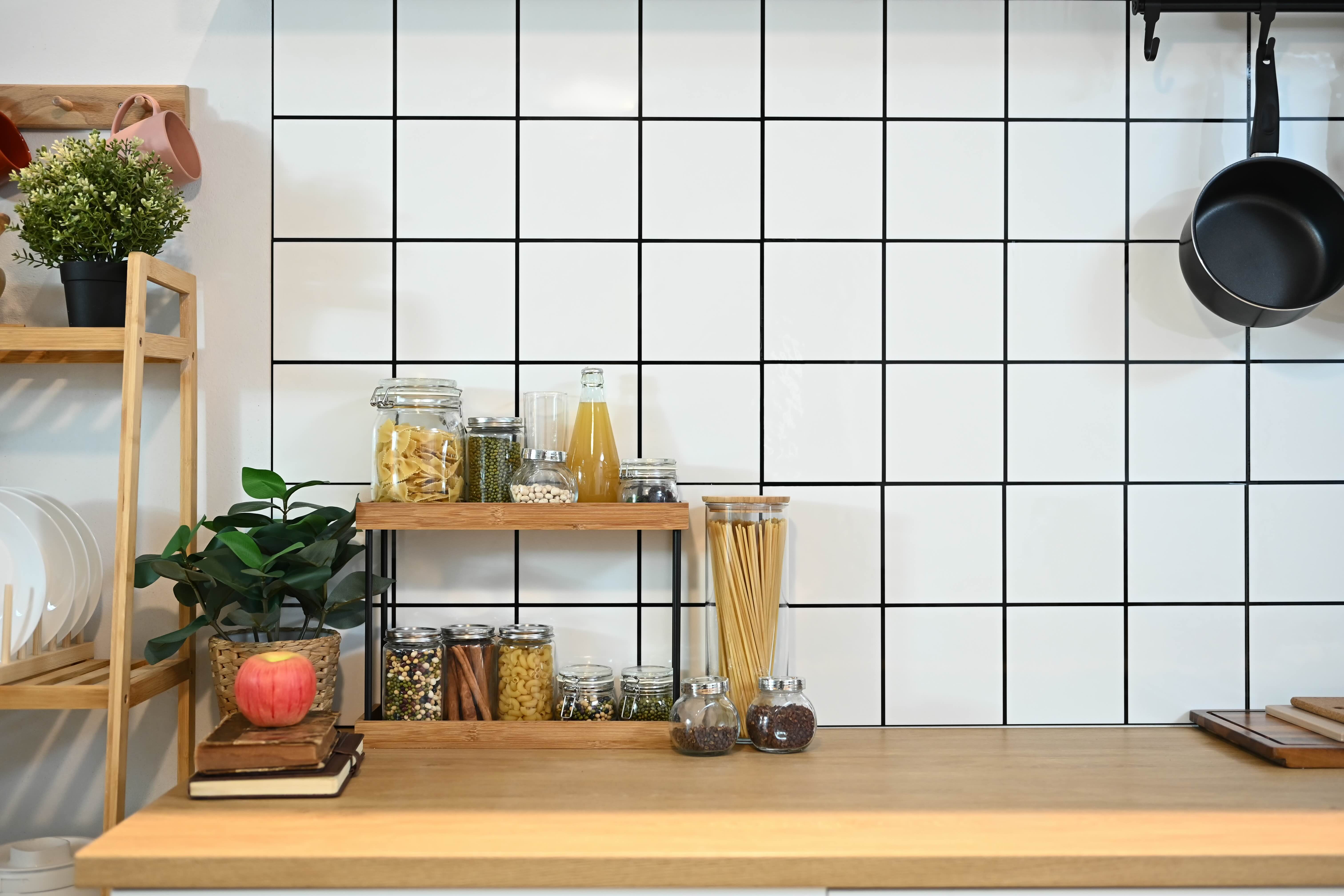 Vinyl tile sticker applied over existing ceramic tile in a rental kitchen